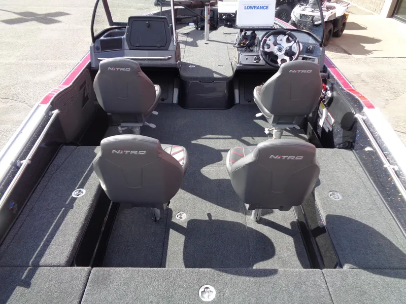 Slide: The Image of 2024 Nitro ZV20 Pro boat interior with four seats and steering console. - 7