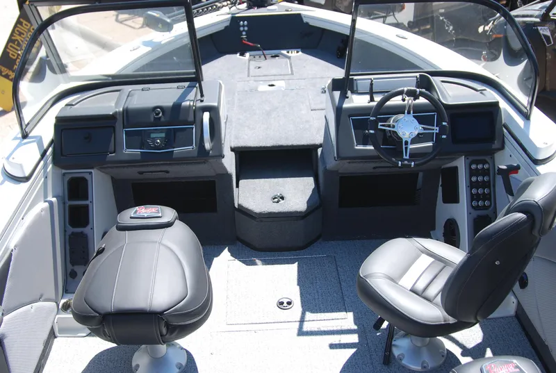 Slide: The Image of 2024 Ranger VX1988 WT boat interior with dual seats and modern dashboard. - 3