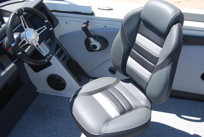 Slide: The Image of 2024 Ranger VX1988 WT boat interior with steering wheel and cushioned seat. - 4