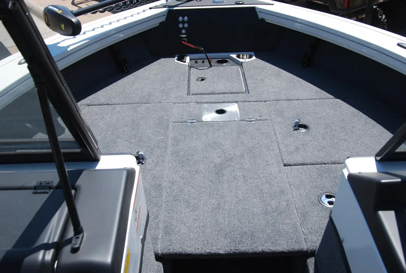 Slide: The Image of 2024 Ranger VX1988 WT boat interior with carpeted deck and storage compartments. - 7