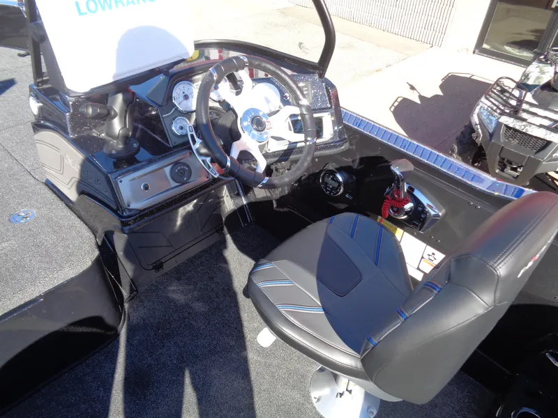 Slide: The Image of 2024 Nitro ZV20 Pro boat cockpit with steering wheel and seat. - 11