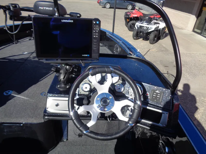 Slide: The Image of 2024 Nitro ZV20 Pro boat dashboard with steering wheel and navigation display. - 12