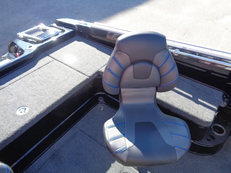Slide: The Image of 2024 Nitro ZV20 Pro boat interior with cushioned seat and carpeted deck. - 16
