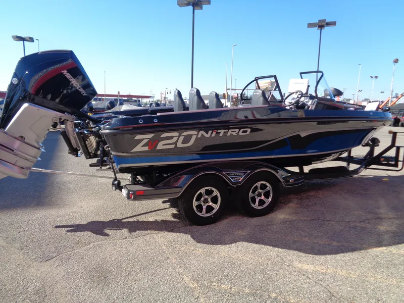 Slide: The Image of 2024 Nitro ZV20 Pro fishing boat on trailer in parking lot. - 3