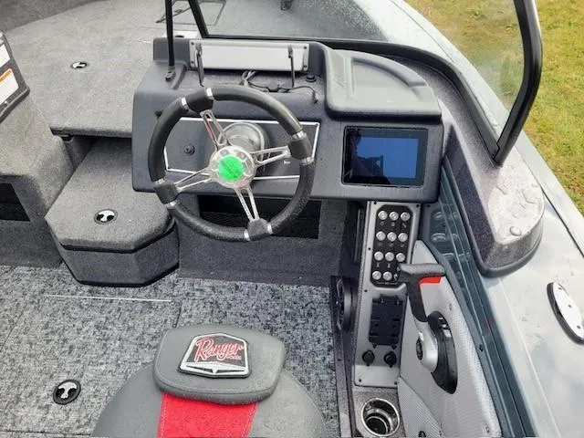 Slide: The Image of 2024 Ranger VX1988 WT boat interior with steering wheel and control panel. - 3