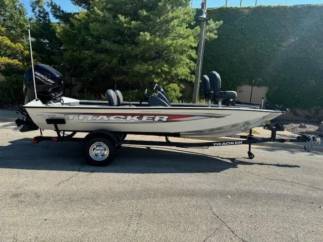 The Image of 2025 Tracker Pro Team 175 Crappie Edition boat on trailer, parked outdoors. - 0