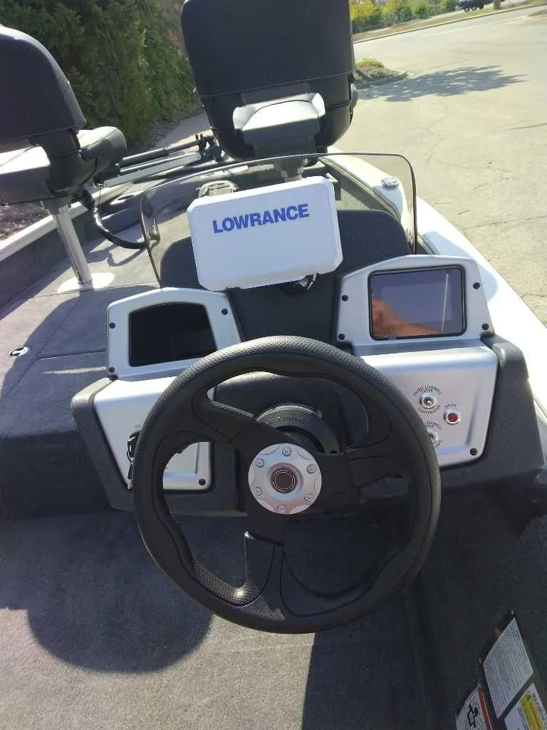 Slide: The Image of 2025 Tracker Pro Team 175 Crappie Edition boat dashboard with Lowrance electronics. - 3