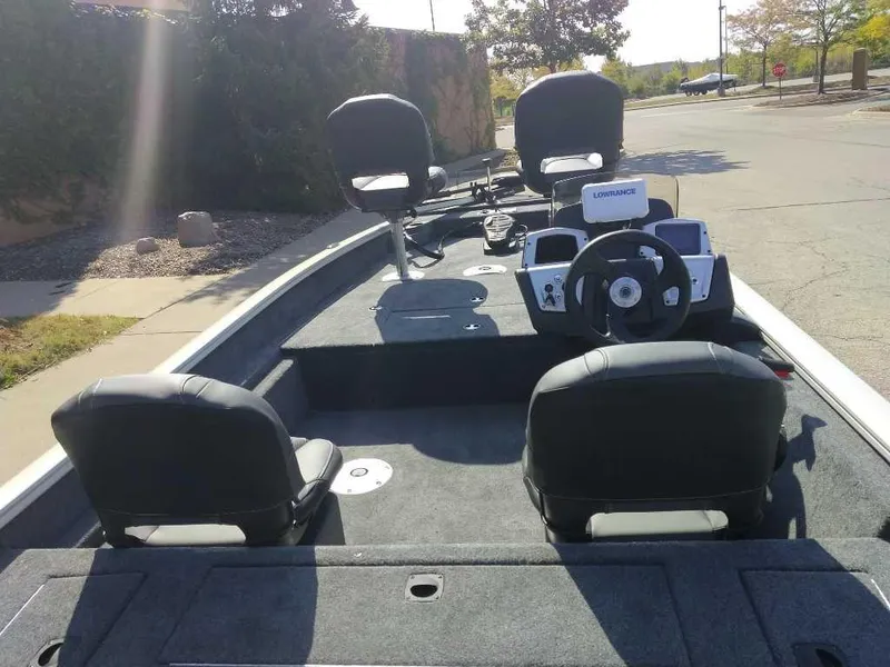 Slide: The Image of 2025 Tracker Pro Team 175 Crappie Edition boat with seating and steering console. - 5