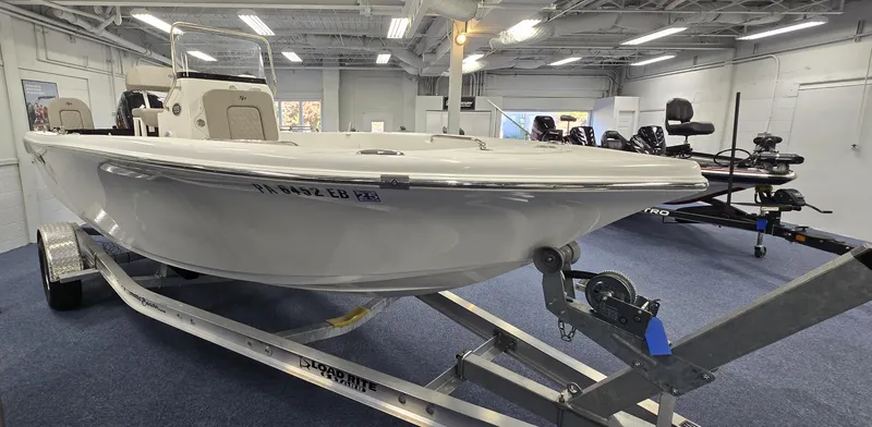 Slide: The Image of 2022 Sea Pro 199 Center Console boat on trailer in showroom. - 10
