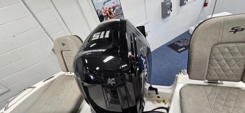 Slide: The Image of 2022 Sea Pro 199 Center Console boat with black outboard motor and cushioned seats. - 5