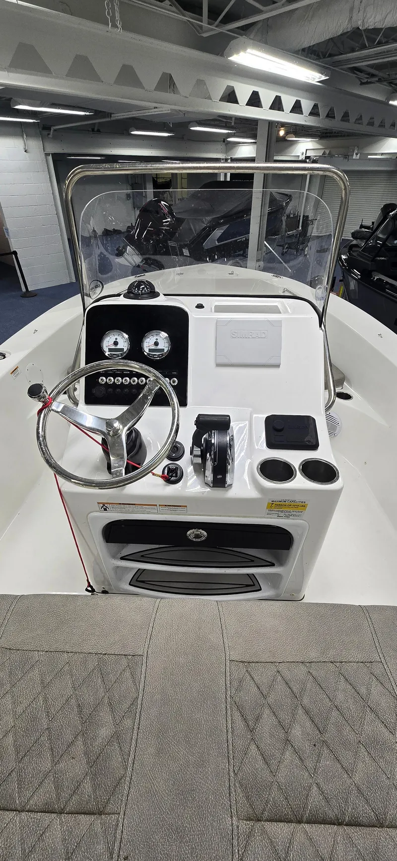 Slide: The Image of 2022 Sea Pro 199 Center Console boat interior with steering wheel and controls. - 7
