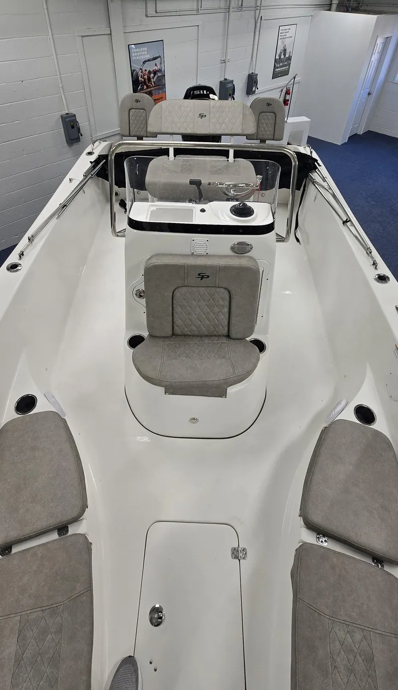 Slide: The Image of 2022 Sea Pro 199 Center Console boat interior with seating and console view. - 9
