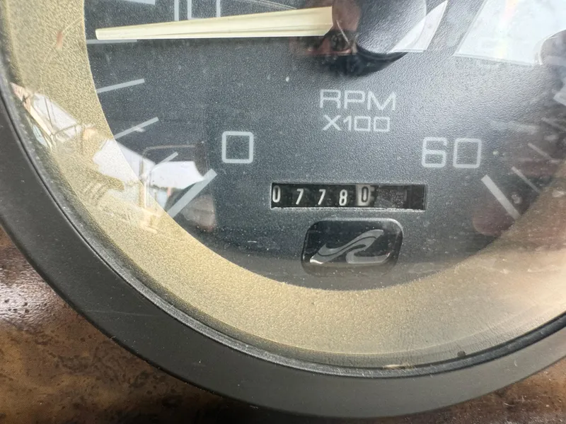 Slide: The Image of Close-up of a 1995 Sea Ray 370 Express Cruiser RPM gauge showing 7780 hours. - 15
