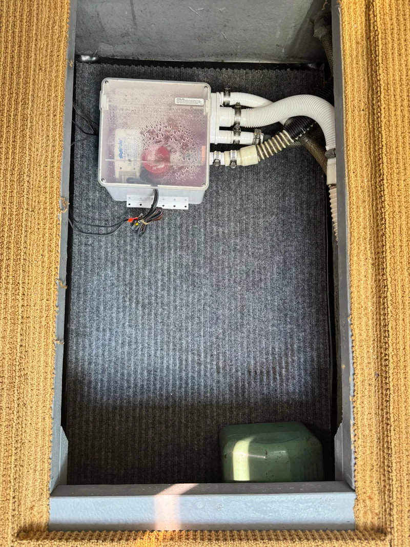 Slide: The Image of Electrical compartment of a 1995 Sea Ray 370 Express Cruiser with wiring and components. - 16