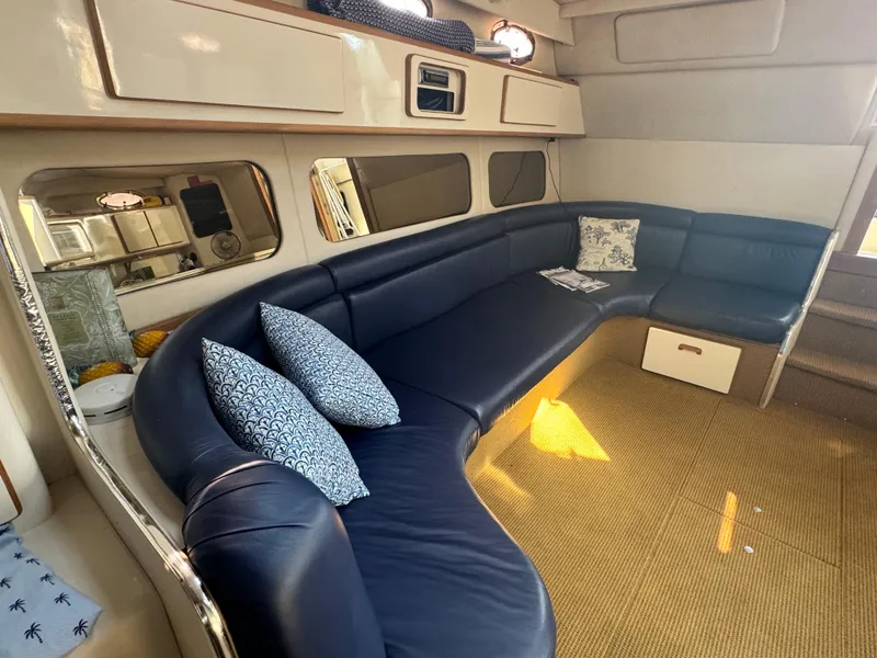 Slide: The Image of Luxurious interior of 1995 Sea Ray 370 Express Cruiser with plush seating and elegant decor. - 19