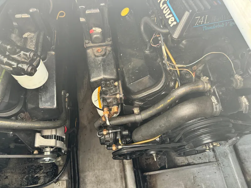 Slide: The Image of Engine compartment of a 1995 Sea Ray 370 Express Cruiser, featuring a 7.4L engine. - 38