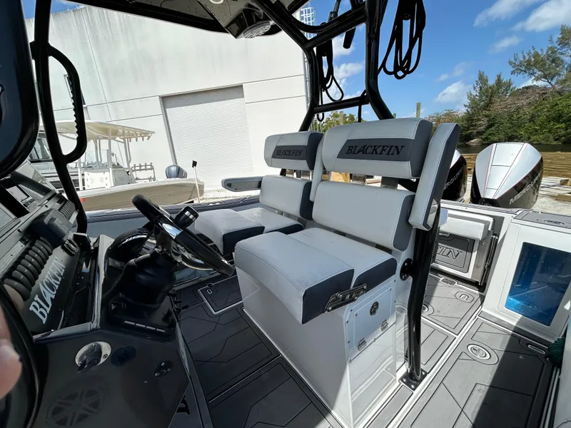 Slide: The Image of 2019 Blackfin 272 CC boat interior with dual seating and steering console. - 10