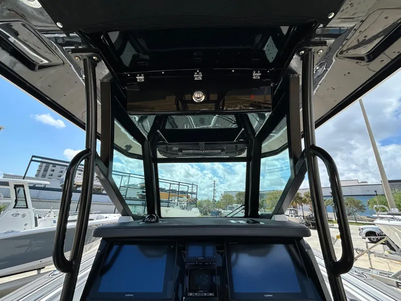 Slide: The Image of 2019 Blackfin 272 CC boat interior with modern dashboard and controls. - 14