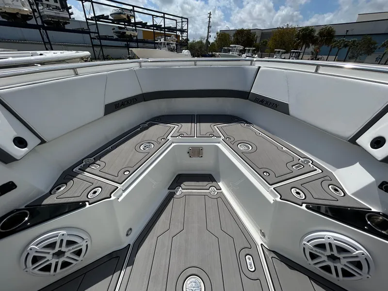 Slide: The Image of 2019 Blackfin 272 CC boat interior with sleek seating and modern design. - 18
