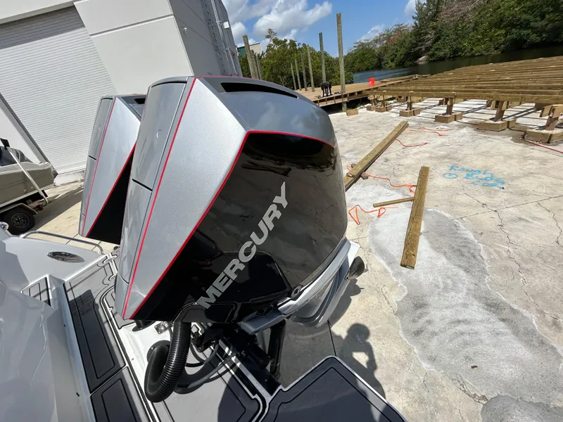 Slide: The Image of 2019 Blackfin 272 CC with dual Mercury outboard engines, dockside view. - 3