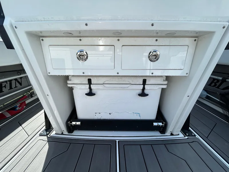Slide: The Image of 2019 Blackfin 272 CC boat storage compartment with drawers and cooler. - 7