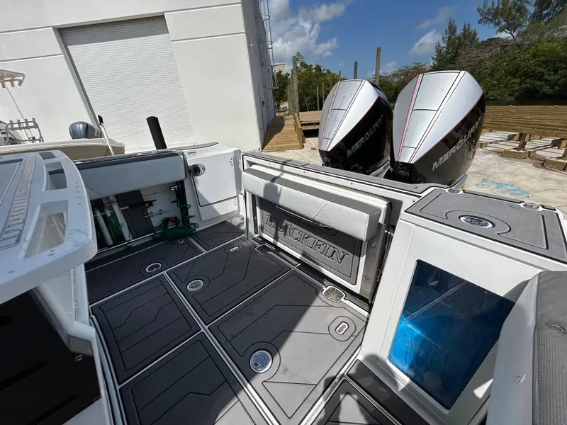 Slide: The Image of 2019 Blackfin 272 CC boat deck with twin Mercury outboard engines. - 9
