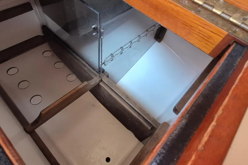 Slide: The Image of Interior view of a 1999 Robinhood Cutter sailboat storage compartment. - 21