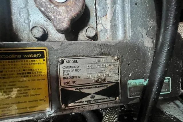 Slide: The Image of Engine identification plate on a 1999 Robinhood Cutter, displaying model and specifications. - 22