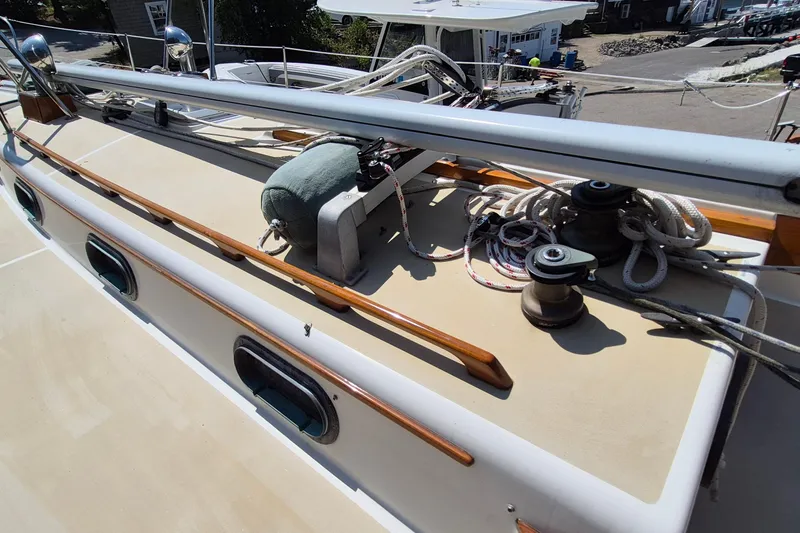 Slide: The Image of Deck of 1999 Robinhood Cutter sailboat with winches and ropes. - 35