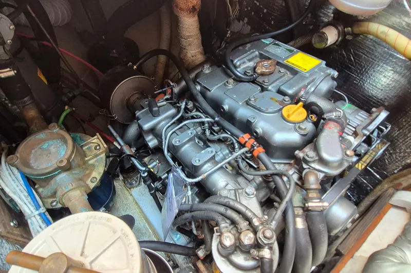 Slide: The Image of Engine compartment of a 1999 Robinhood Cutter, showcasing detailed mechanical components. - 46