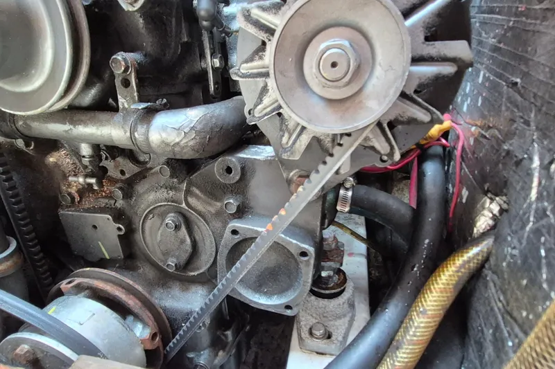 Slide: The Image of Close-up of a 1999 Robinhood Cutter engine with visible belts and components. - 47