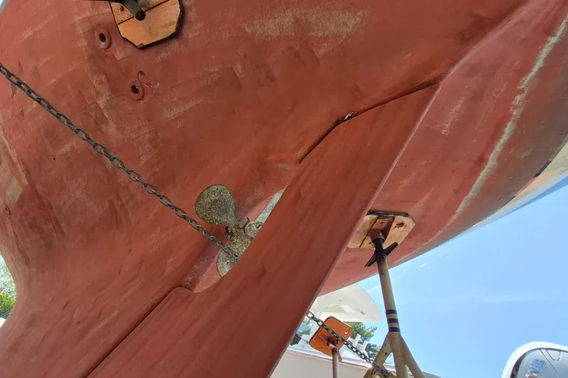 Slide: The Image of Underside view of a 1999 Robinhood Cutter boat, showing propeller and rudder. - 62