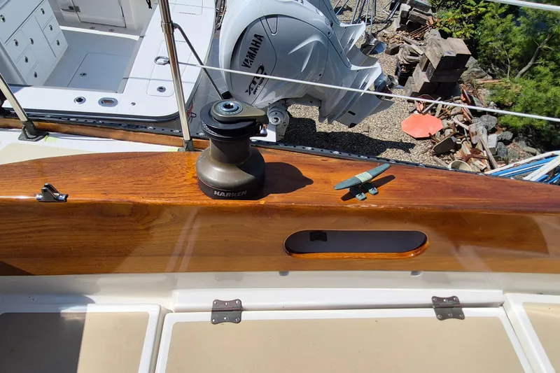 Slide: The Image of 1999 Robinhood Cutter sailboat deck with Harken winch and Yamaha engine. - 38