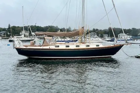 Slide: The Image of Sailboat on water, 1999 Robinhood Cutter model, docked in a marina with other boats. - 65