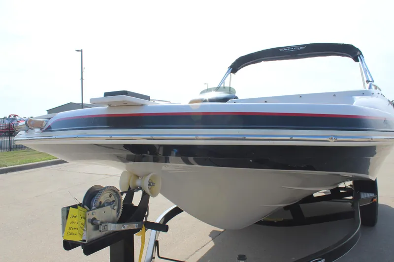 Slide: The Image of 2015 Tahoe 215 I/O boat on trailer, side view, sunny day. - 10