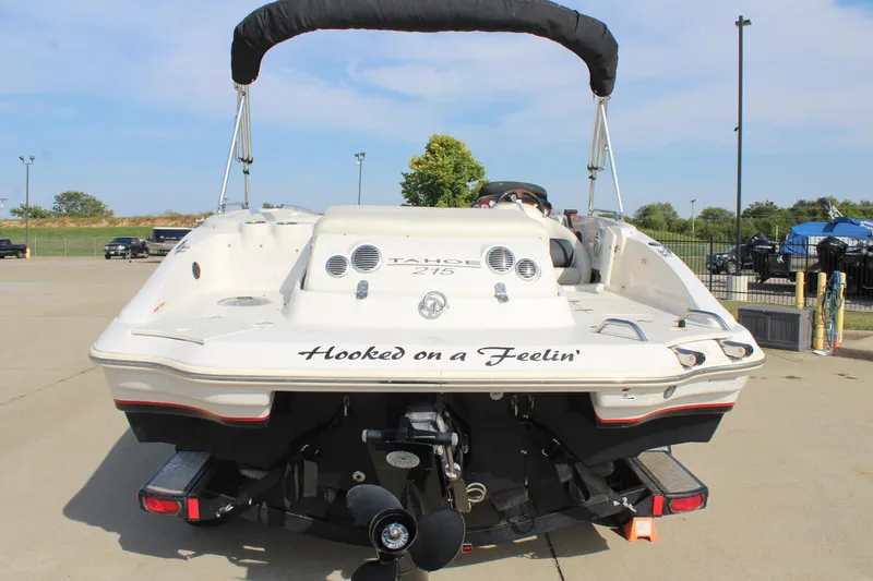 Slide: The Image of 2015 Tahoe 215 I/O boat with "Hooked on a Feelin'" text on the stern. - 13