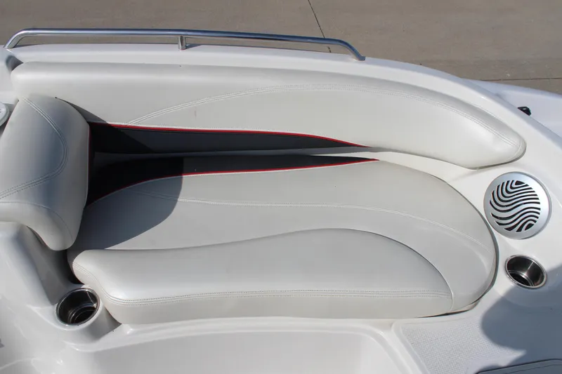 Slide: The Image of 2015 Tahoe 215 I/O boat interior seating with cup holders and speaker. - 18