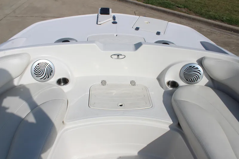 Slide: The Image of 2015 Tahoe 215 I/O boat interior with speakers and seating. - 19