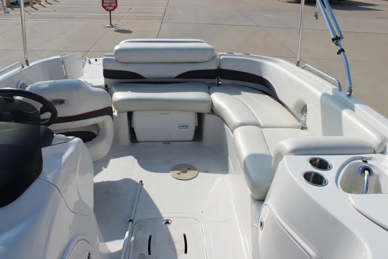 Slide: The Image of 2015 Tahoe 215 I/O boat interior with white seating and cup holders. - 21
