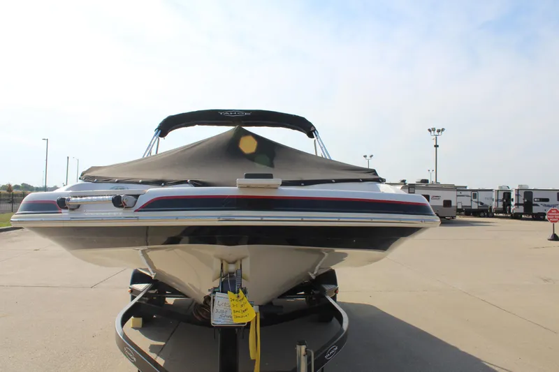 Slide: The Image of 2015 Tahoe 215 I/O boat on trailer, covered and parked outdoors. - 3