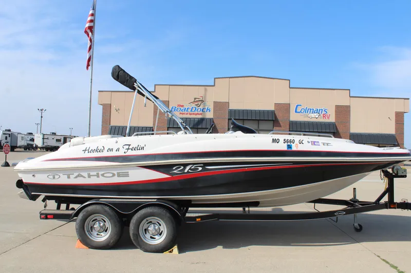 Slide: The Image of 2015 Tahoe 215 I/O boat on trailer, parked outside dealership. - 7