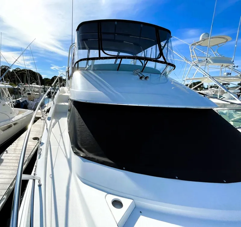 Slide: The Image of 2006 Silverton 39 Motor Yacht docked under clear blue sky. - 13