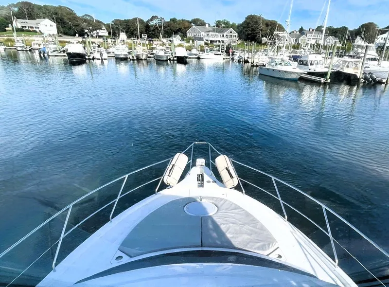 Slide: The Image of 2006 Silverton 39 Motor Yacht docked in a scenic marina. - 16