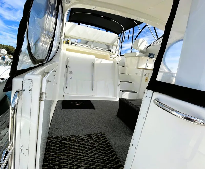 Slide: The Image of 2006 Silverton 39 Motor Yacht interior with stairs and seating, featuring sleek design and modern amenities. - 18