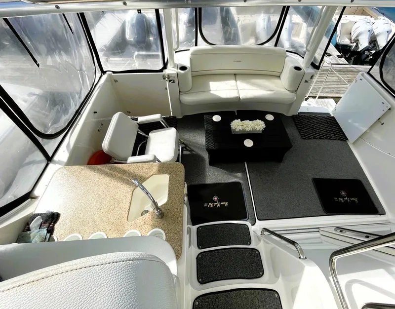 Slide: The Image of 2006 Silverton 39 Motor Yacht interior with seating, table, and kitchenette. - 20