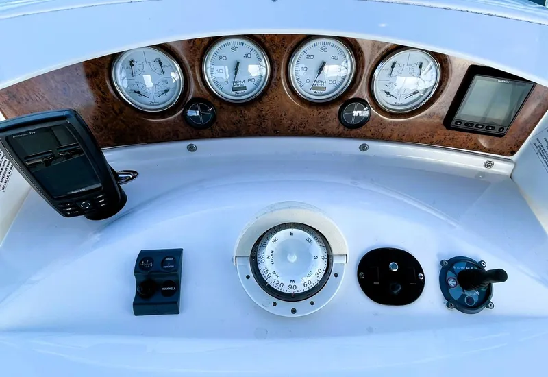 Slide: The Image of Control panel of 2006 Silverton 39 Motor Yacht with gauges and navigation instruments. - 28