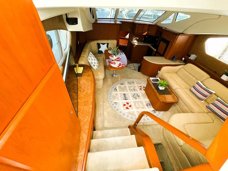 Slide: The Image of Luxurious interior of 2006 Silverton 39 Motor Yacht with plush seating and elegant decor. - 30