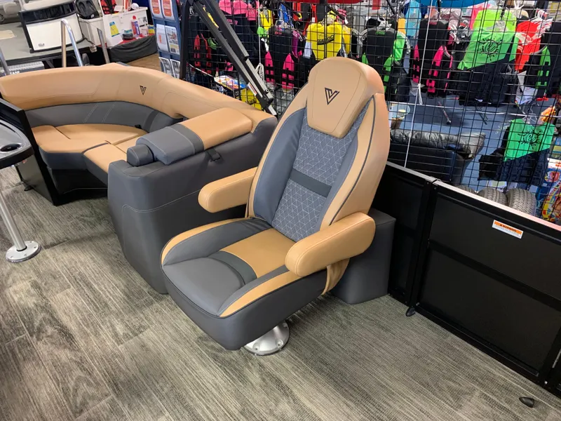 Slide: The Image of 2025 Viaggio Lago Z22U boat seats, featuring luxurious tan and gray upholstery in a showroom setting. - 5