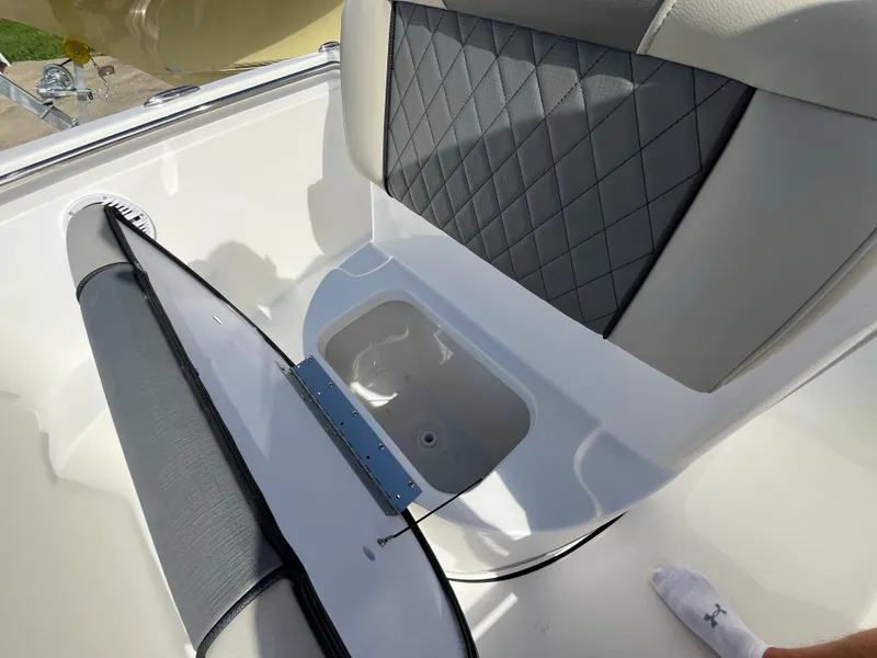 Slide: The Image of 2025 Key West 189 FS boat seat with storage compartment open. - 15