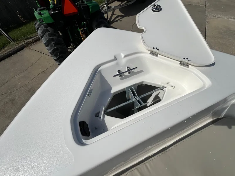 Slide: The Image of 2025 Key West 189 FS boat anchor compartment, open lid, white finish. - 18